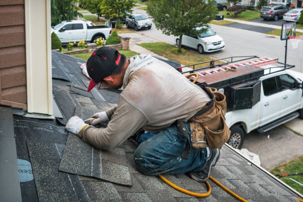 Professional Storm Damage Roof Repair technician working in Corrigan, TX